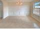Bright dining room features tile floors, crown molding, wainscoting, a window and modern lighting at 40 Zebulon Pl, Covington, GA 30016