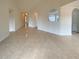 Bright and open-concept interior featuring neutral tile flooring and an open layout at 40 Zebulon Pl, Covington, GA 30016