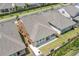 Aerial view of the backyard featuring a patio, lawn, and privacy fence at 163 Lorraine Pkwy, Woodstock, GA 30188