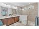 Modern bathroom with double vanity, shower, and decorative accents at 163 Lorraine Pkwy, Woodstock, GA 30188
