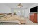 Bright bedroom with large bed, dresser, carpet, and ceiling fan at 163 Lorraine Pkwy, Woodstock, GA 30188