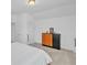 Bright bedroom with a neutral tones, carpeted floor and large dresser at 163 Lorraine Pkwy, Woodstock, GA 30188