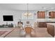 Cozy dining area adjacent to the kitchen, complete with a modern chandelier and ample natural light at 163 Lorraine Pkwy, Woodstock, GA 30188