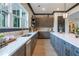 Modern kitchen boasts stainless steel appliances, spacious countertops and stylish cabinetry at 163 Lorraine Pkwy, Woodstock, GA 30188