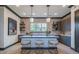 Stylish kitchen featuring a quartz countertop island, elegant pendant lighting, and modern cabinetry at 163 Lorraine Pkwy, Woodstock, GA 30188