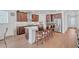 Modern kitchen with stainless steel appliances, granite countertops, and island seating at 163 Lorraine Pkwy, Woodstock, GA 30188