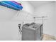 Modern laundry room with stainless steel washer and dryer, plus ample storage space at 163 Lorraine Pkwy, Woodstock, GA 30188