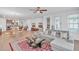 Bright living space with open floorplan, seamlessly connecting the kitchen, dining, and living room areas at 163 Lorraine Pkwy, Woodstock, GA 30188