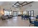 Spacious open-concept lounge area with hardwood floors and designer furniture at 163 Lorraine Pkwy, Woodstock, GA 30188