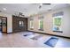 Studio space with lots of natural light, light wood floor, and exercise mats at 163 Lorraine Pkwy, Woodstock, GA 30188