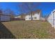 Spacious backyard featuring a wood fence, trees, and a shed for extra storage at 4047 Round Stone Trl, Snellville, GA 30039