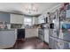 A kitchen showcasing white cabinets, stainless steel appliances, and a decorative tile backsplash at 4047 Round Stone Trl, Snellville, GA 30039