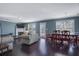 Open-concept space with hardwood floors featuring a dining and living area with lots of natural light at 4047 Round Stone Trl, Snellville, GA 30039