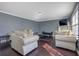 Bright living room showcases hardwood floors, neutral furniture, and an open layout at 4047 Round Stone Trl, Snellville, GA 30039