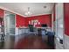 Home office space with multiple desks, dark wood floors and natural light from the window at 4047 Round Stone Trl, Snellville, GA 30039