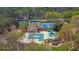 Aerial view of community amenities, including tennis courts, pools, and playgrounds at 4330 Old Oak Trce, Cumming, GA 30041