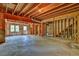 Unfinished basement with exposed wooden framework and concrete flooring at 4330 Old Oak Trce, Cumming, GA 30041