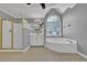 Spacious bathroom with double sinks, a glass shower, a tub, and tile flooring at 4330 Old Oak Trce, Cumming, GA 30041