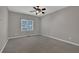 Spacious bedroom offers neutral colors and ample natural light from the windows at 4330 Old Oak Trce, Cumming, GA 30041