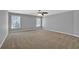 Expansive bedroom with two windows and carpet flooring provides a serene atmosphere at 4330 Old Oak Trce, Cumming, GA 30041