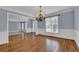 Elegant dining room featuring a chandelier and hardwood floors at 4330 Old Oak Trce, Cumming, GA 30041