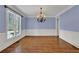 Formal dining room with hardwood floors and traditional chandelier at 4330 Old Oak Trce, Cumming, GA 30041