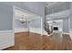 Open-concept dining room showcasing hardwood floors and view into the foyer at 4330 Old Oak Trce, Cumming, GA 30041
