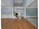 Bright foyer with hardwood floors, staircase, and a view into other rooms at 4330 Old Oak Trce, Cumming, GA 30041