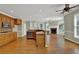Eat-in kitchen features wood cabinets, stainless appliances, and an open fireplace view at 4330 Old Oak Trce, Cumming, GA 30041