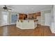 Kitchen area with wood floors, a breakfast bar, and plenty of cabinet space at 4330 Old Oak Trce, Cumming, GA 30041