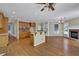 Open kitchen with breakfast bar, wood cabinets, and recessed lighting at 4330 Old Oak Trce, Cumming, GA 30041