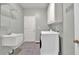 Convenient laundry room includes washer, dryer, sink, and storage cabinets at 4330 Old Oak Trce, Cumming, GA 30041