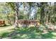 Cozy brick home surrounded by mature trees, offering a private and serene setting at 4479 Richard Rd, Conley, GA 30288