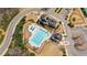 Aerial view showcases the pool, clubhouse, playground, and parking area in the neighborhood at 6350 Boulder Rdg, Cumming, GA 30028