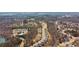Wide aerial shot of a housing community with walking trails, amenities, and surrounding wooded areas at 6350 Boulder Rdg, Cumming, GA 30028