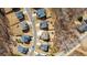 An aerial view showcases a residential neighborhood with well-maintained homes and green spaces at 6350 Boulder Rdg, Cumming, GA 30028
