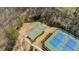 Overhead view of community basketball court and tennis courts surrounded by lush greenery at 6350 Boulder Rdg, Cumming, GA 30028