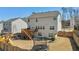 Backyard view featuring a spacious yard, deck, patio, and play equipment for outdoor enjoyment at 6350 Boulder Rdg, Cumming, GA 30028