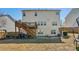 Expansive backyard with a deck, patio, play set, and ample space for outdoor activities at 6350 Boulder Rdg, Cumming, GA 30028