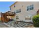 Inviting backyard with a wooden deck, stone patio, fire pit, and well-maintained landscaping at 6350 Boulder Rdg, Cumming, GA 30028