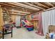 Unfinished basement area featuring a basketball game and foosball table at 6350 Boulder Rdg, Cumming, GA 30028