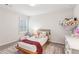Cozy bedroom with natural light, plush carpet, area rug, and a comfortable bed and furniture at 6350 Boulder Rdg, Cumming, GA 30028