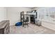 Bedroom featuring carpet flooring, a loft bed with desk, and built-in storage at 6350 Boulder Rdg, Cumming, GA 30028