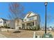 Lovely two-story home with a brick and siding exterior, cozy front porch, and landscaped front yard at 6350 Boulder Rdg, Cumming, GA 30028