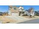 Attractive two-story home with brick and siding, a spacious driveway, and a well-kept front lawn at 6350 Boulder Rdg, Cumming, GA 30028