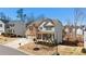Beautiful two-story home boasting a brick facade, inviting front porch, and meticulously landscaped front yard at 6350 Boulder Rdg, Cumming, GA 30028