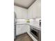 Bright kitchen features white cabinets, subway tile backsplash, stainless steel microwave, and granite countertops at 6350 Boulder Rdg, Cumming, GA 30028