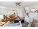 Open concept living room with view of kitchen, comfortable seating, and a stylish design at 6350 Boulder Rdg, Cumming, GA 30028
