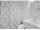 Clean bathroom featuring a vanity and a shower with a patterned curtain at 7013 Mahonia Pl, Lithonia, GA 30038