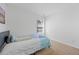 Bright bedroom has natural light, carpet flooring, and light gray walls at 7013 Mahonia Pl, Lithonia, GA 30038